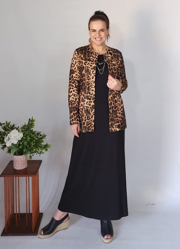 Woman wearing the Emily Button Detail Jacket in a stylish leopard print pattern