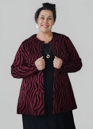 Woman wearing an Emily Custom Style Jacket in a maroon and black zebra print design