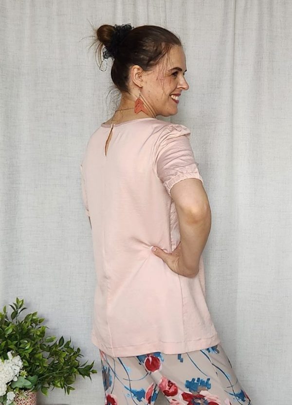 Lila Airflow Top by J&S Creations Clothing, a lightweight pink blouse with puffed sleeves and soft elastic detailing, perfect for South African women seeking comfort and style. Locally made and available in various sizes and colours.