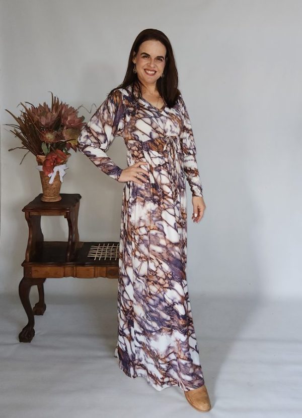 Women wearing the Zane Drawstring Maxi Dress with long sleeves
