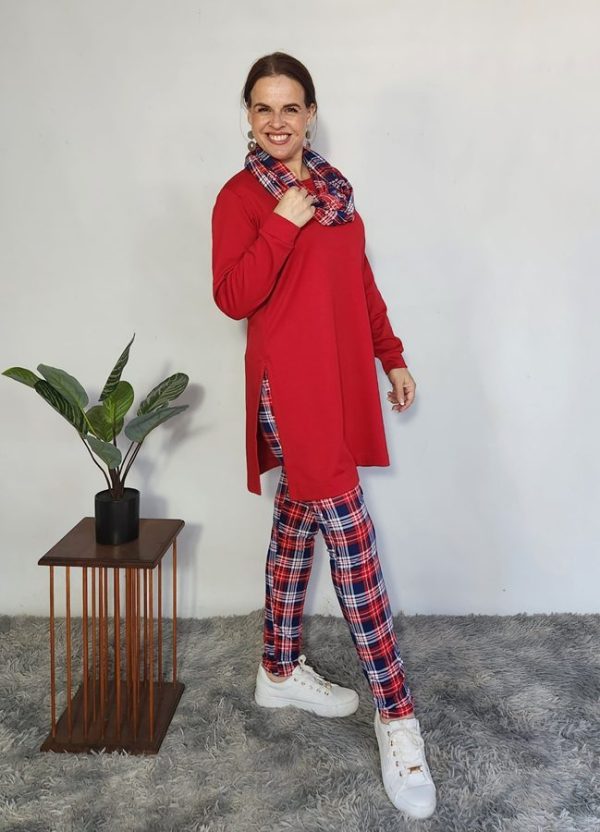 Vibrant woman modeling the Lilly 3-Piece Set by J&S Creations in bold red Terry Knit, paired with red and navy checkered DTY brush knit leggings and a matching snood. A cheerful, custom-made winter outfit designed in South Africa, available in sizes Small to 6XL for confident and comfortable everyday wear.
